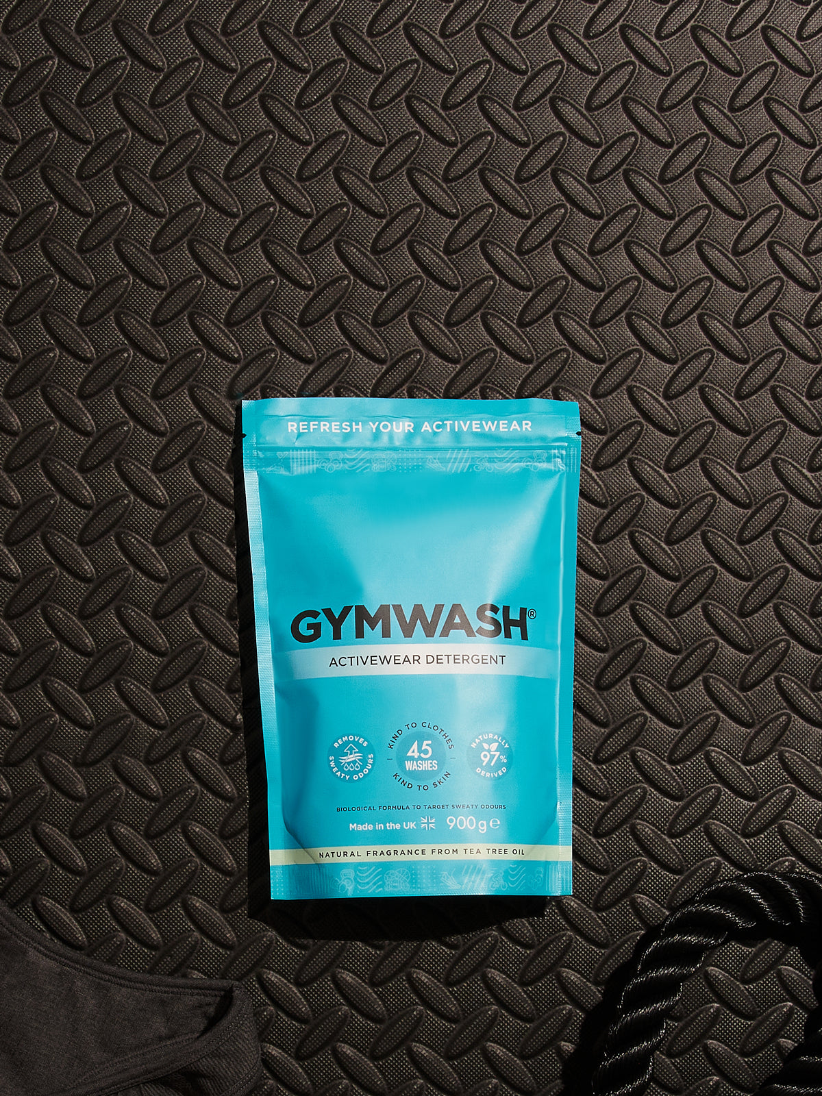 GYMWASH pouch on a gym tile floor.